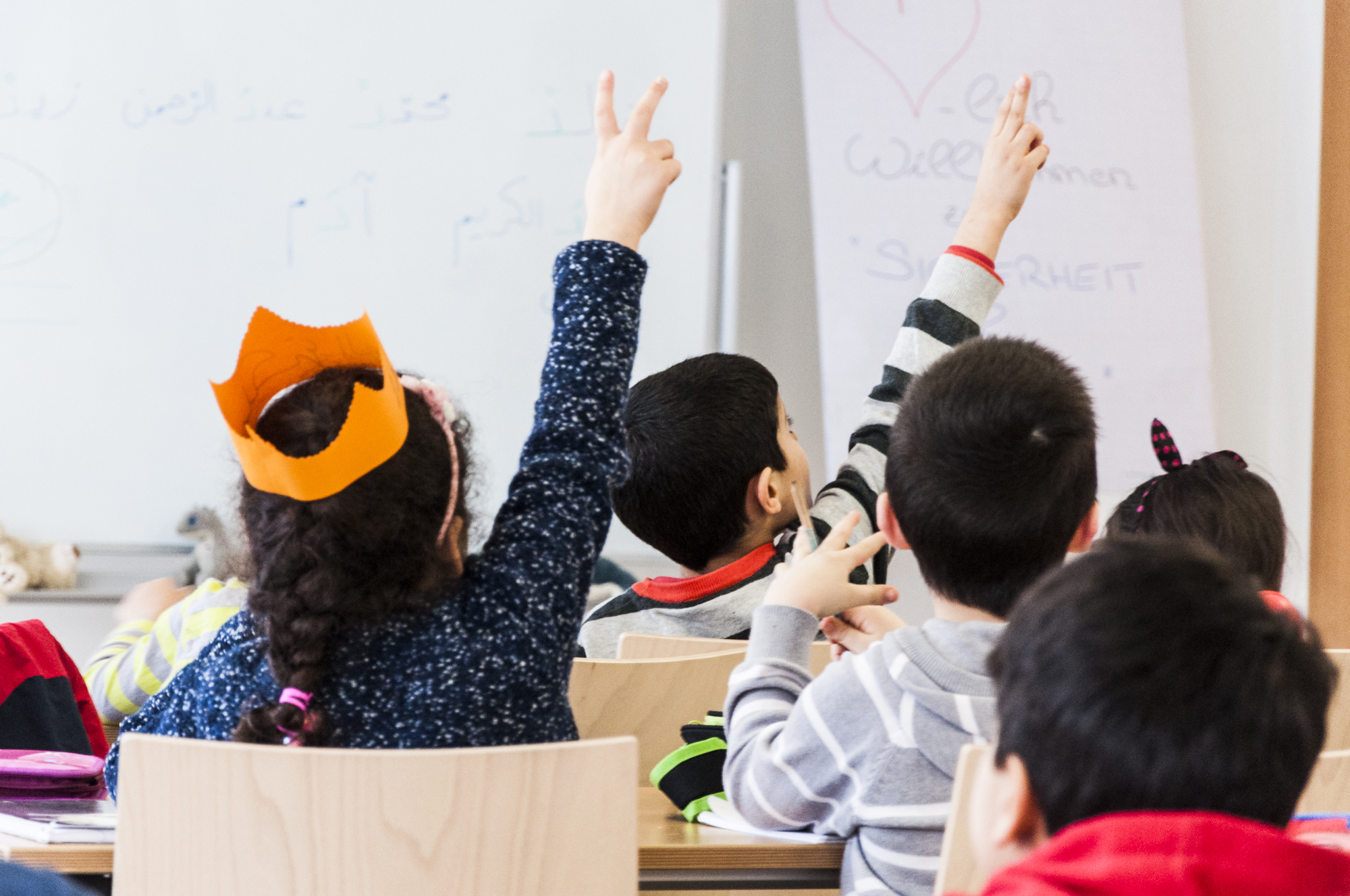 kids raising hands