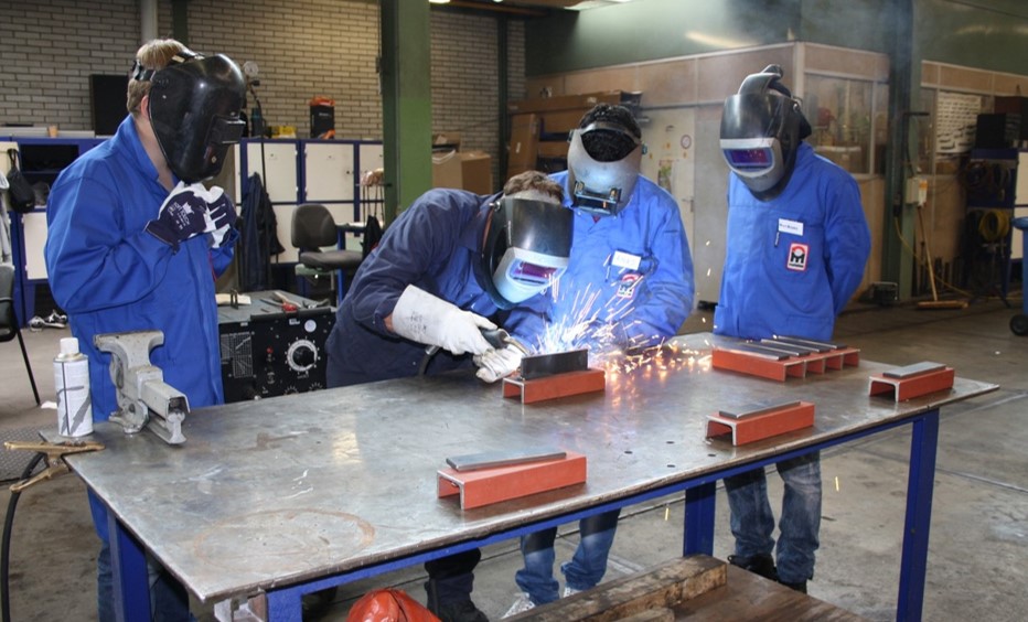 students learning a technical job