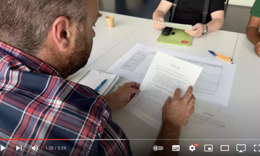 A man reading a document during one of the workshop on Rudi&#039;s governance model