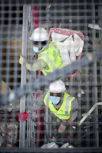 Construction workers with masks 