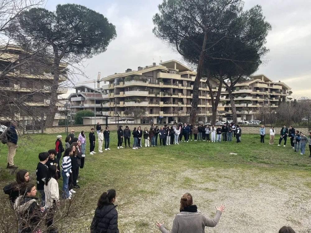 group of youth in a semi-circle during a project activity